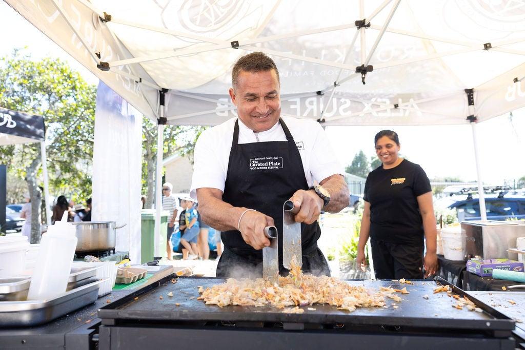 Chef Peter Kuruvita cooking on a hot plate