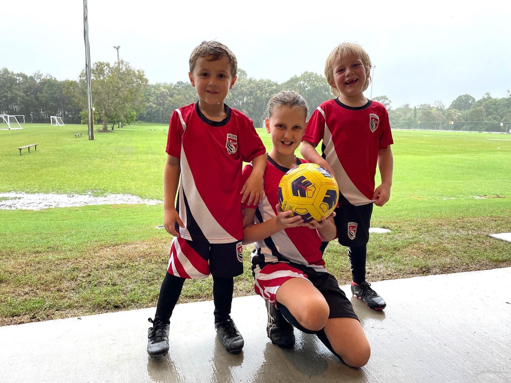 Young Caloundra City Soccer Club players - Hunter, Kayla and fourth generation club player James Ronan