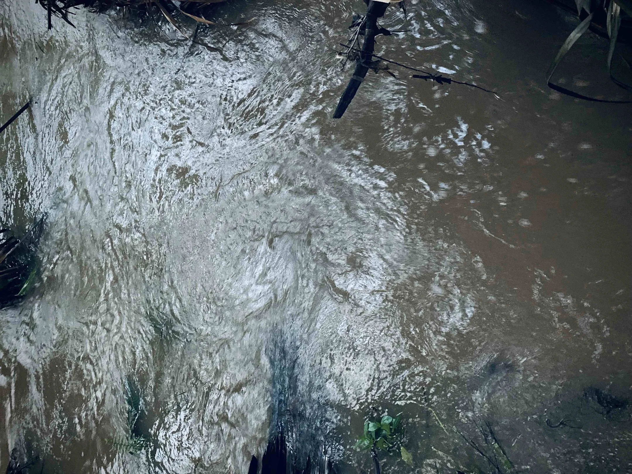 Fast moving flood water.