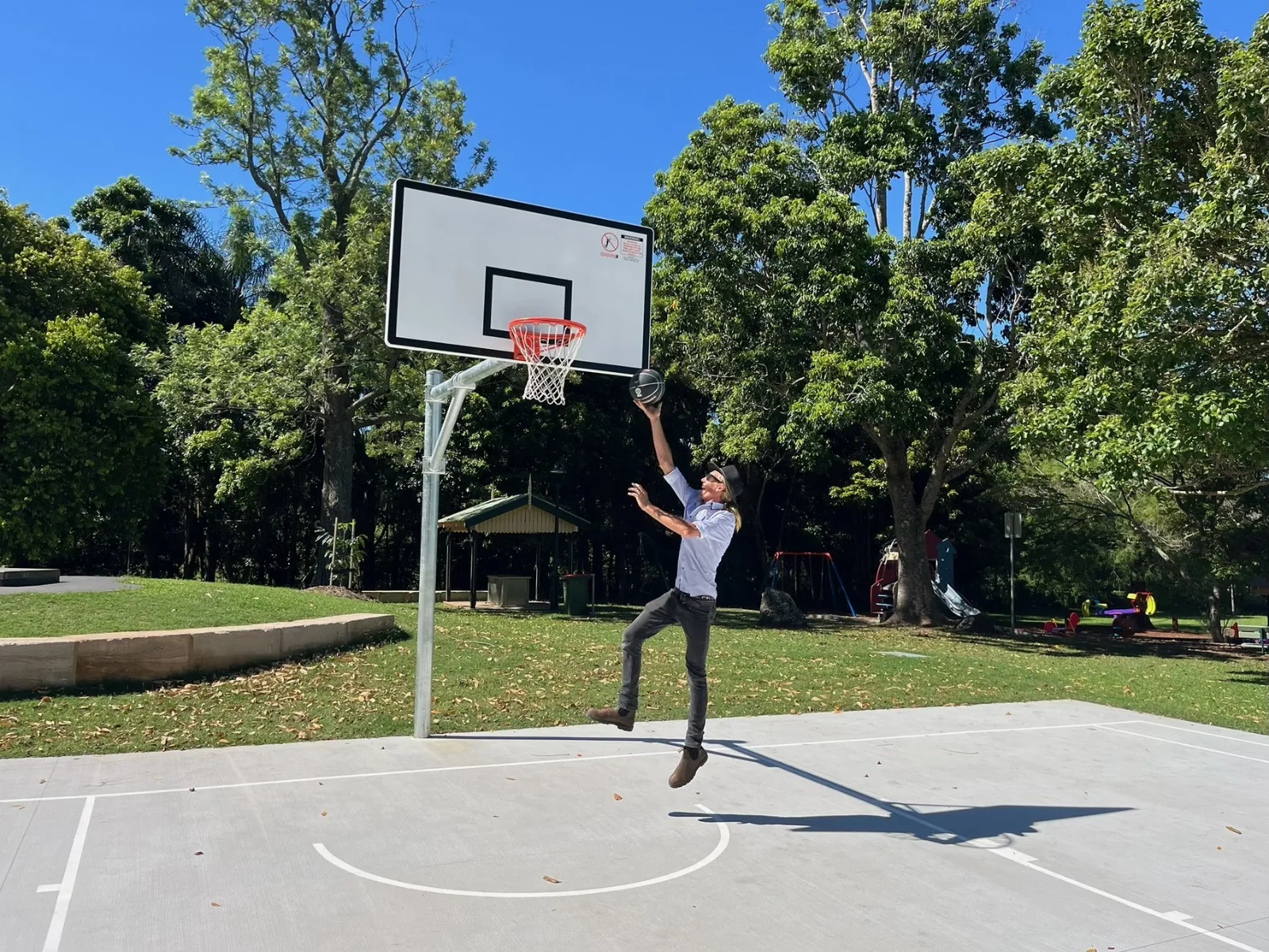 1600x1200 feature photo of man shooting basketball at new half court at Mapleton Lilyponds Park