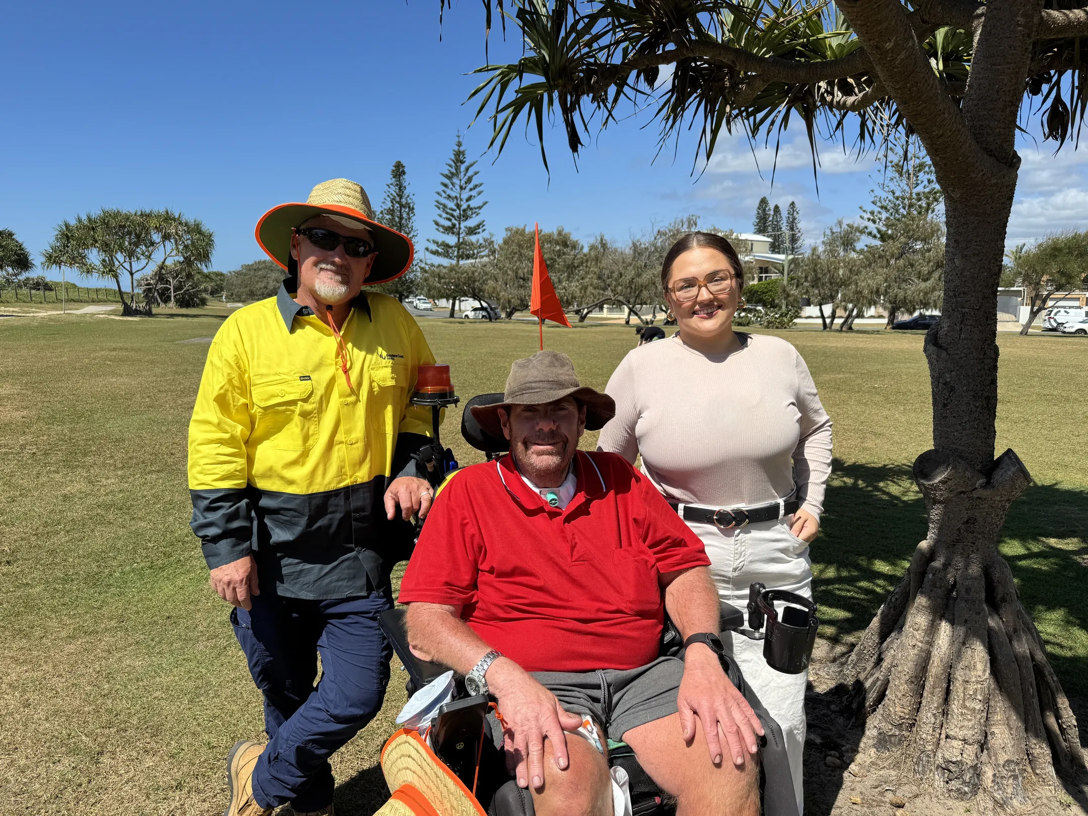 Parks and Gardens worker Patrick Holden, local Peter Tutin and Neta Care Holistic Services support professional Megan Licciardello.