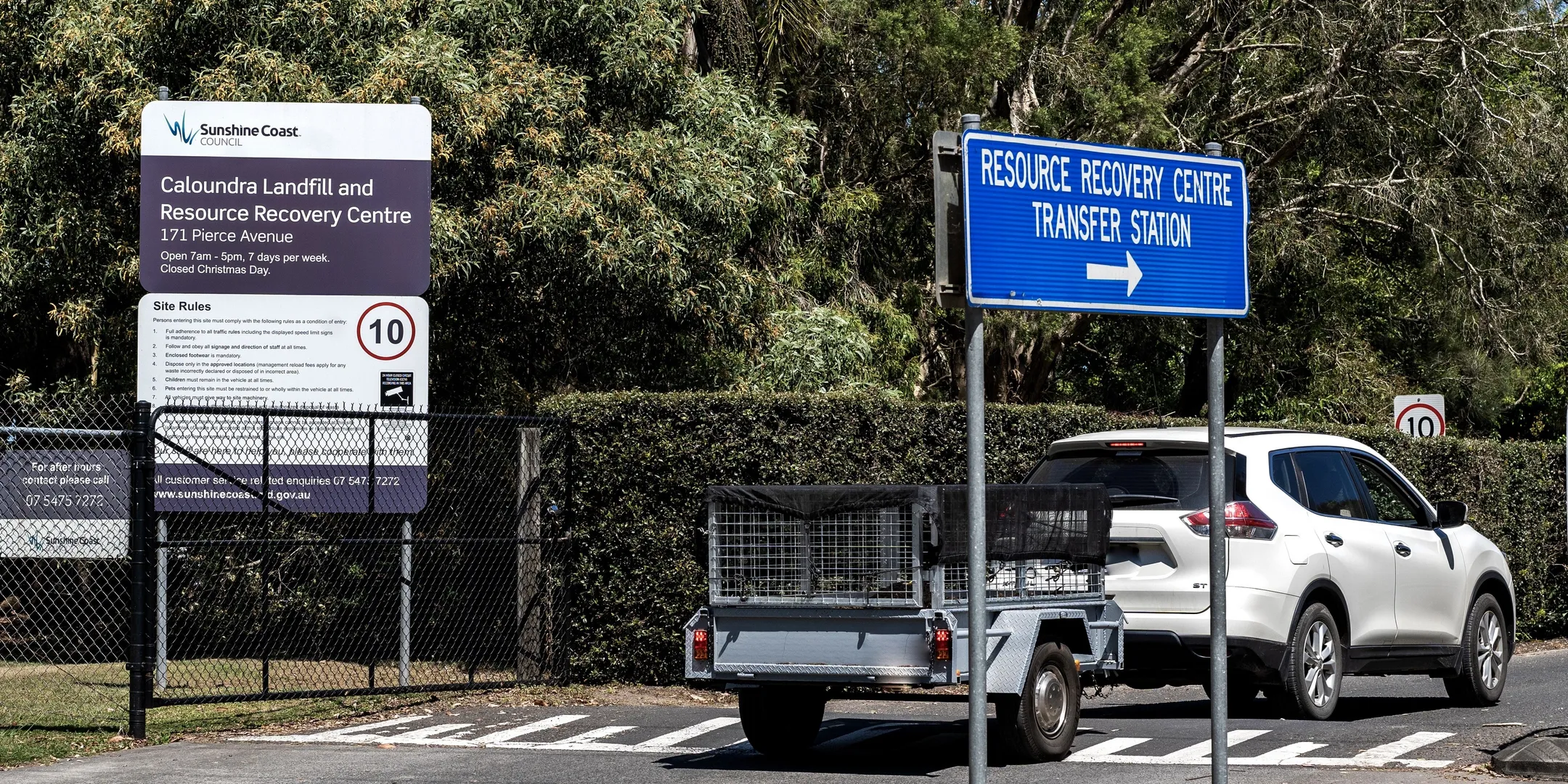 White car towing a small trailer entering the Caloundra tip.