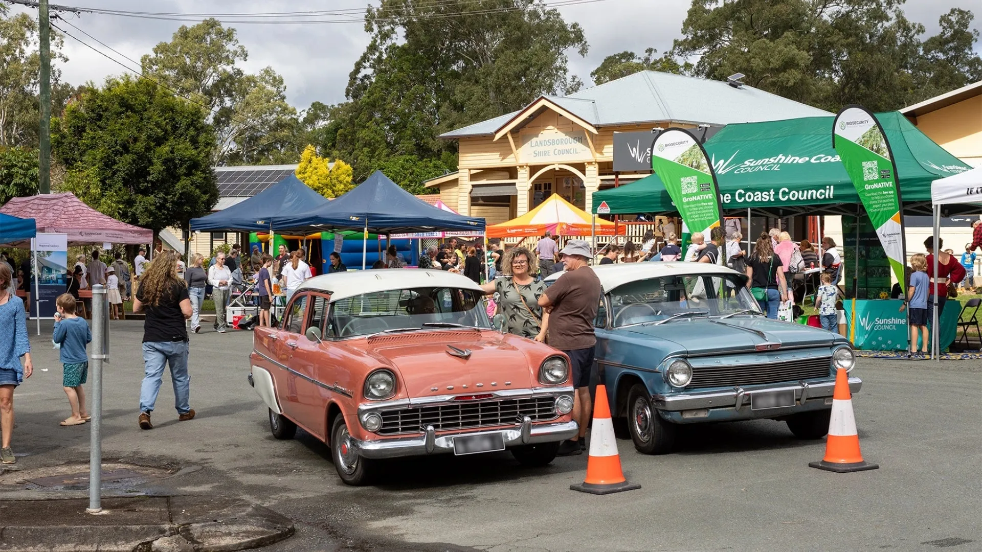 An image about Cool cars, tunes and history at street festival