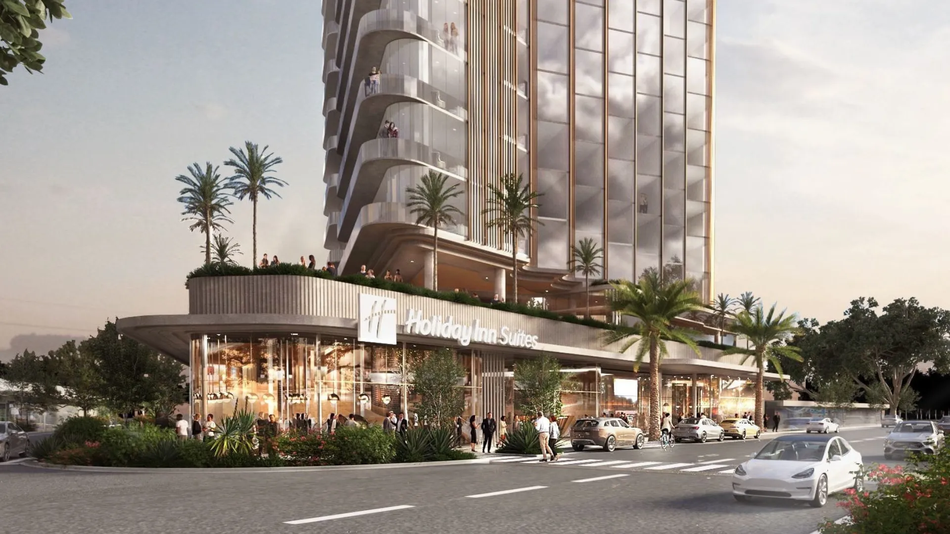 Modern beachfront hotel with a sleek facade, featuring ground-level cafes and outdoor seating with palm trees and a relaxed, coastal atmosphere.