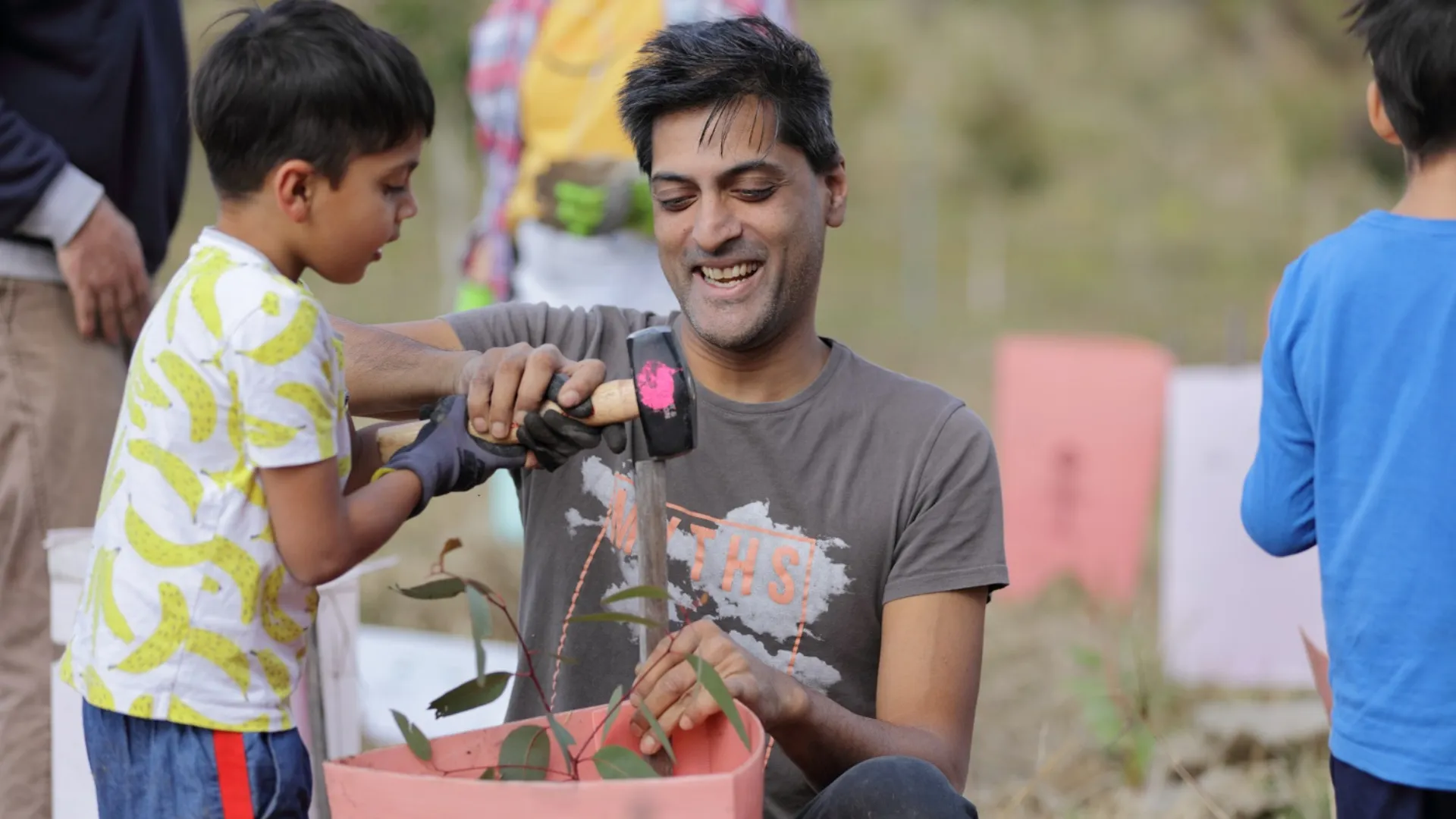 Father and son planting a tree