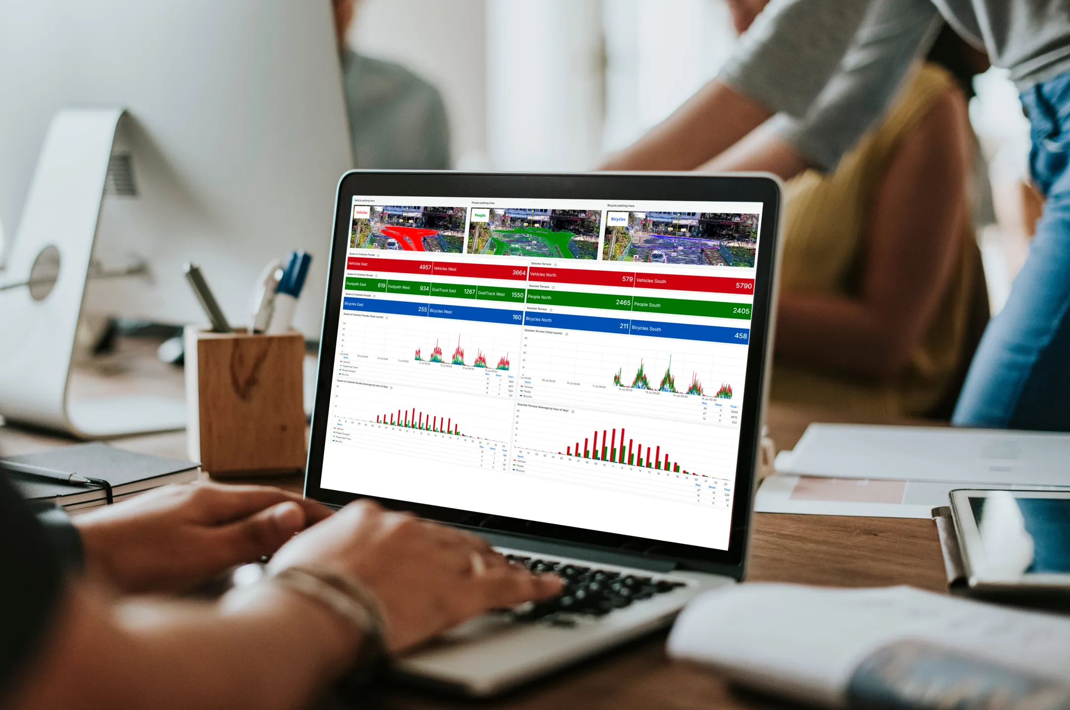 Someone looking at data on laptop