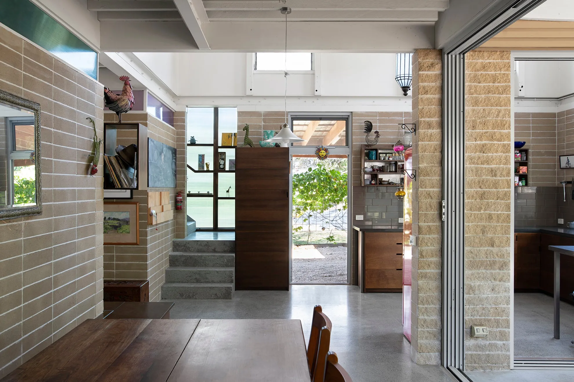 Interior house design showing flood resilience with cement floor and walls.