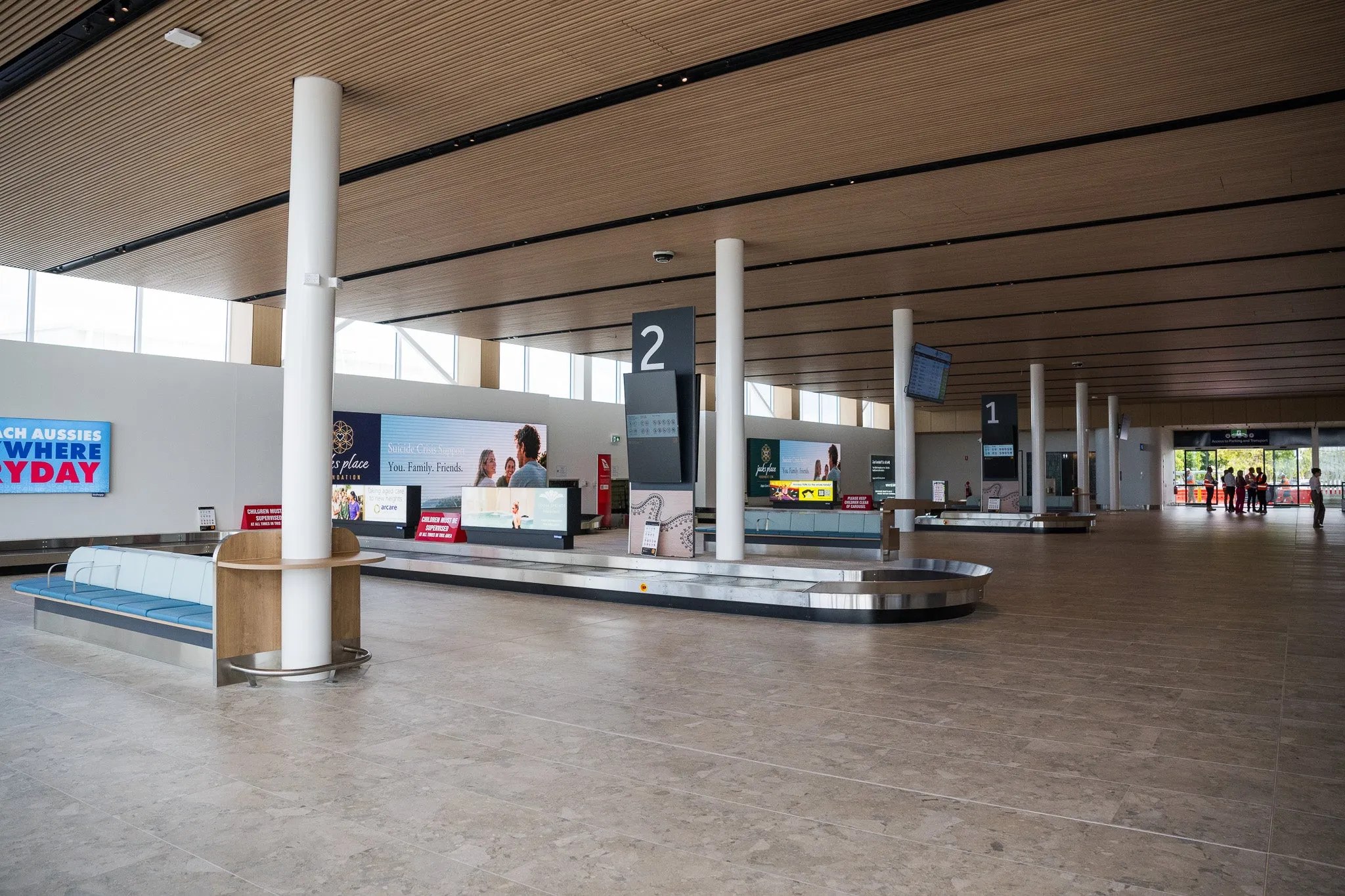 the newly upgraded airport arrival area - poles, conveyor bels, signage