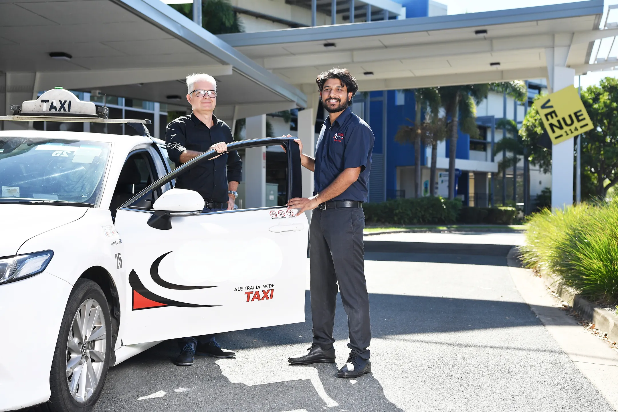 Person stepping into a cab with assistance, highlighting accessible transport options provided by Sunshine Coast Council’s Council Link service.