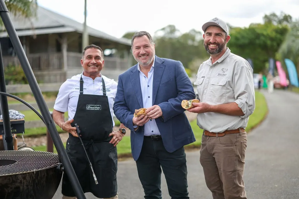 Three men standing next to a BBQ - from L to R - Peter Kuruvita, Minister for the Environment and Tourism Andrew Powell, name of third man TBA
