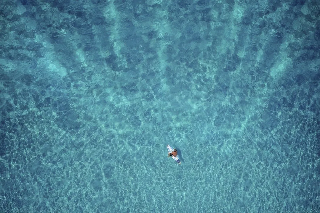 Man on surf board in ocean
