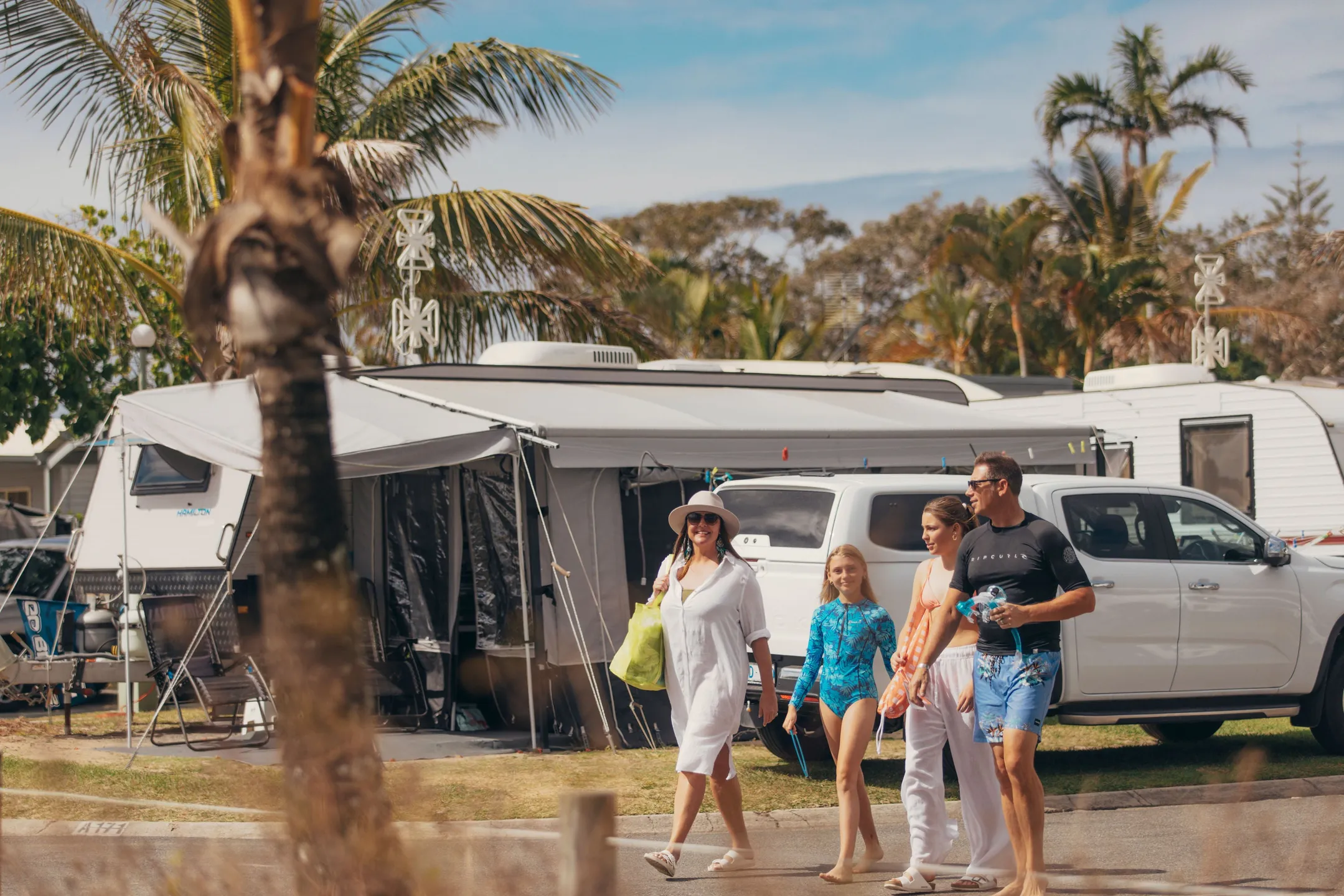 Family walking through Cotton Tree Beach Holiday Park