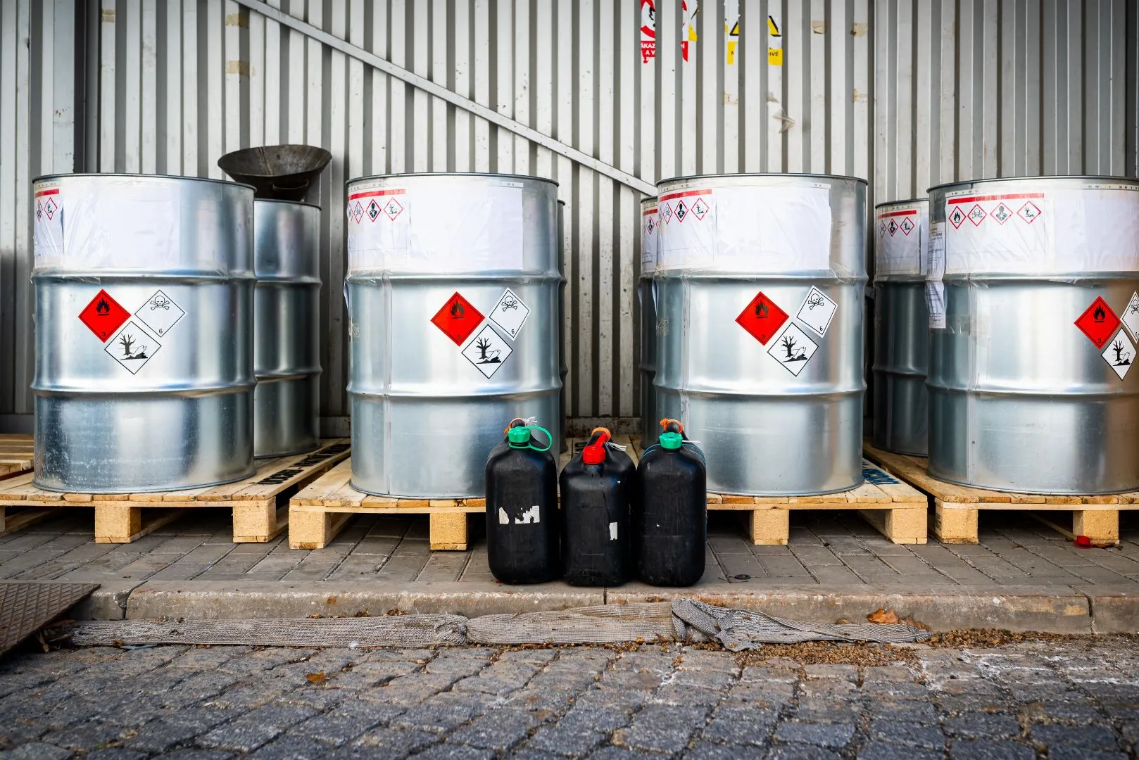 Four rows of silver drums in a shed
