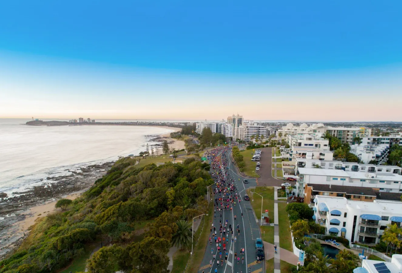 Sunshine Coast Marathon - drone shot of racers on the coastal road route