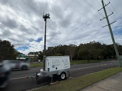 Data trailer parked on side of road