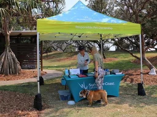 Responsible pet ownership marquee in park near the beach.