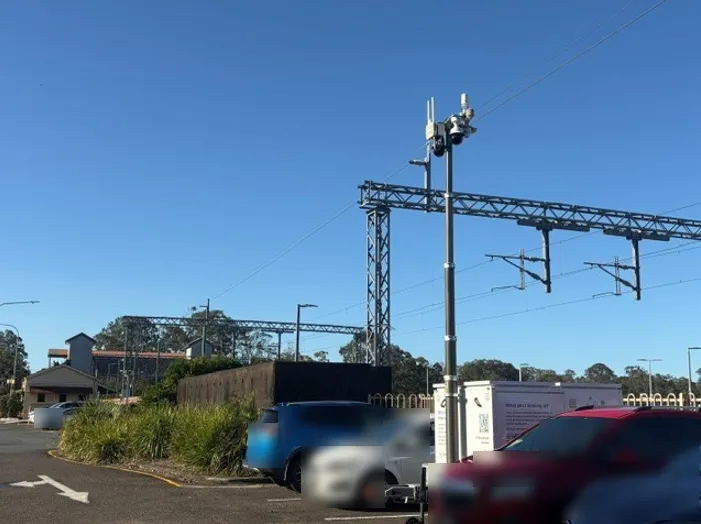 Data trailer parked next to train station