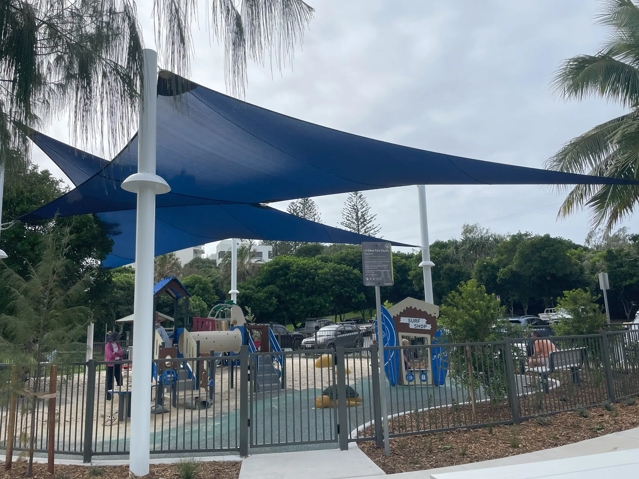 Fenced new playground with shade sail at La Balsa Park, Buddina