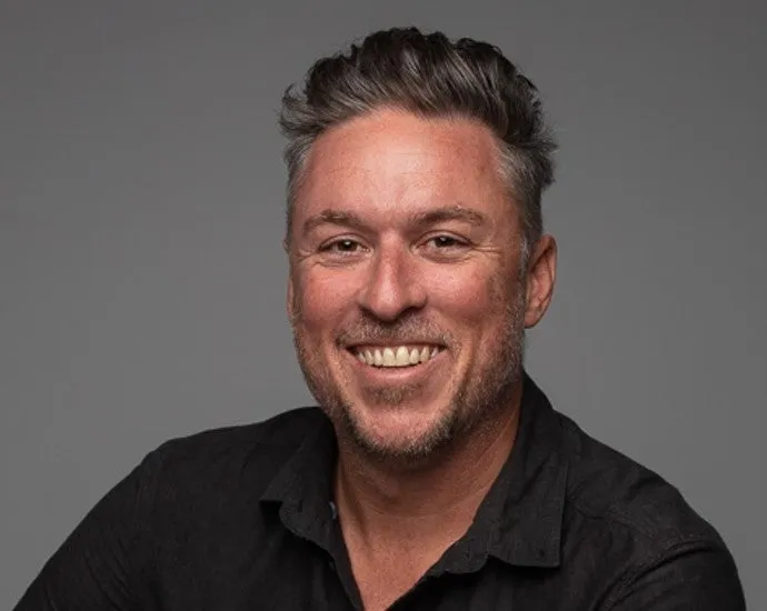 Andrew%20Maccoll%20Headshot%20-%20May%202023.jpg