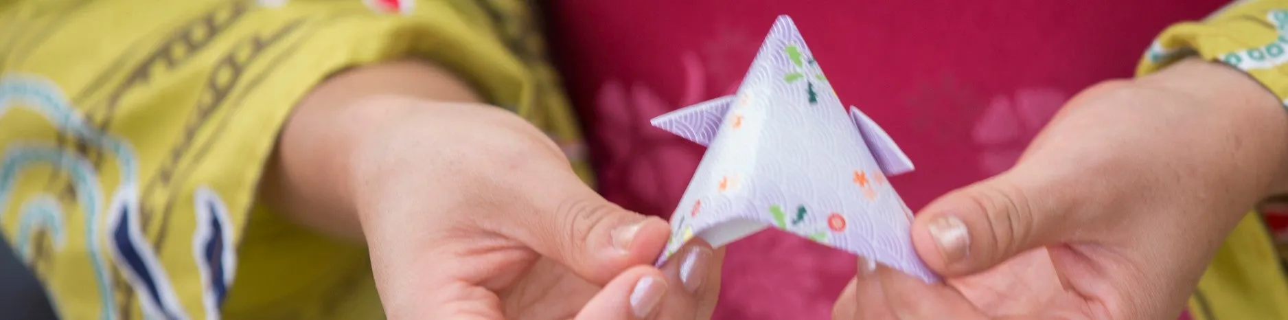 Woman folding origami.