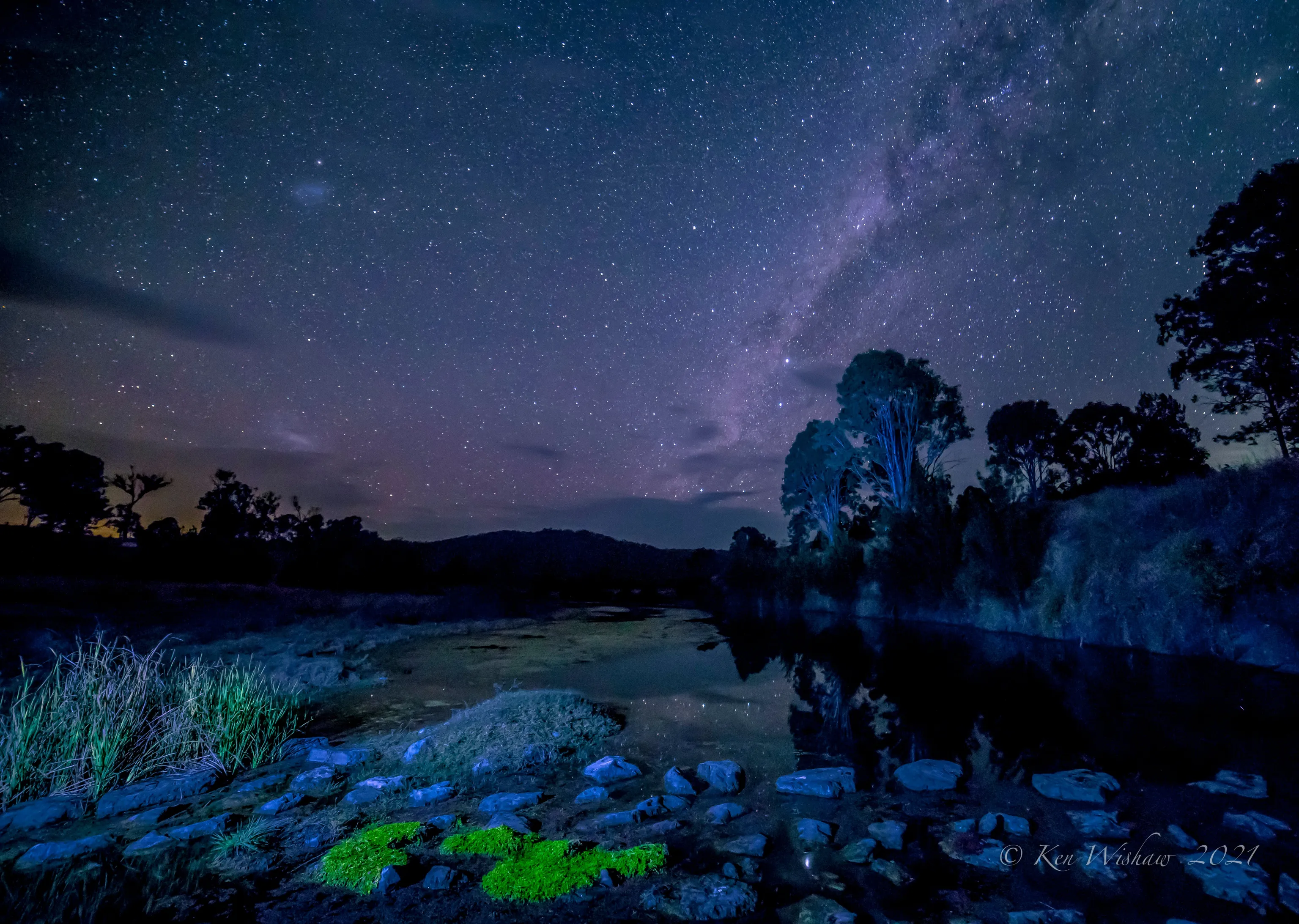 The Milky Way over a river.