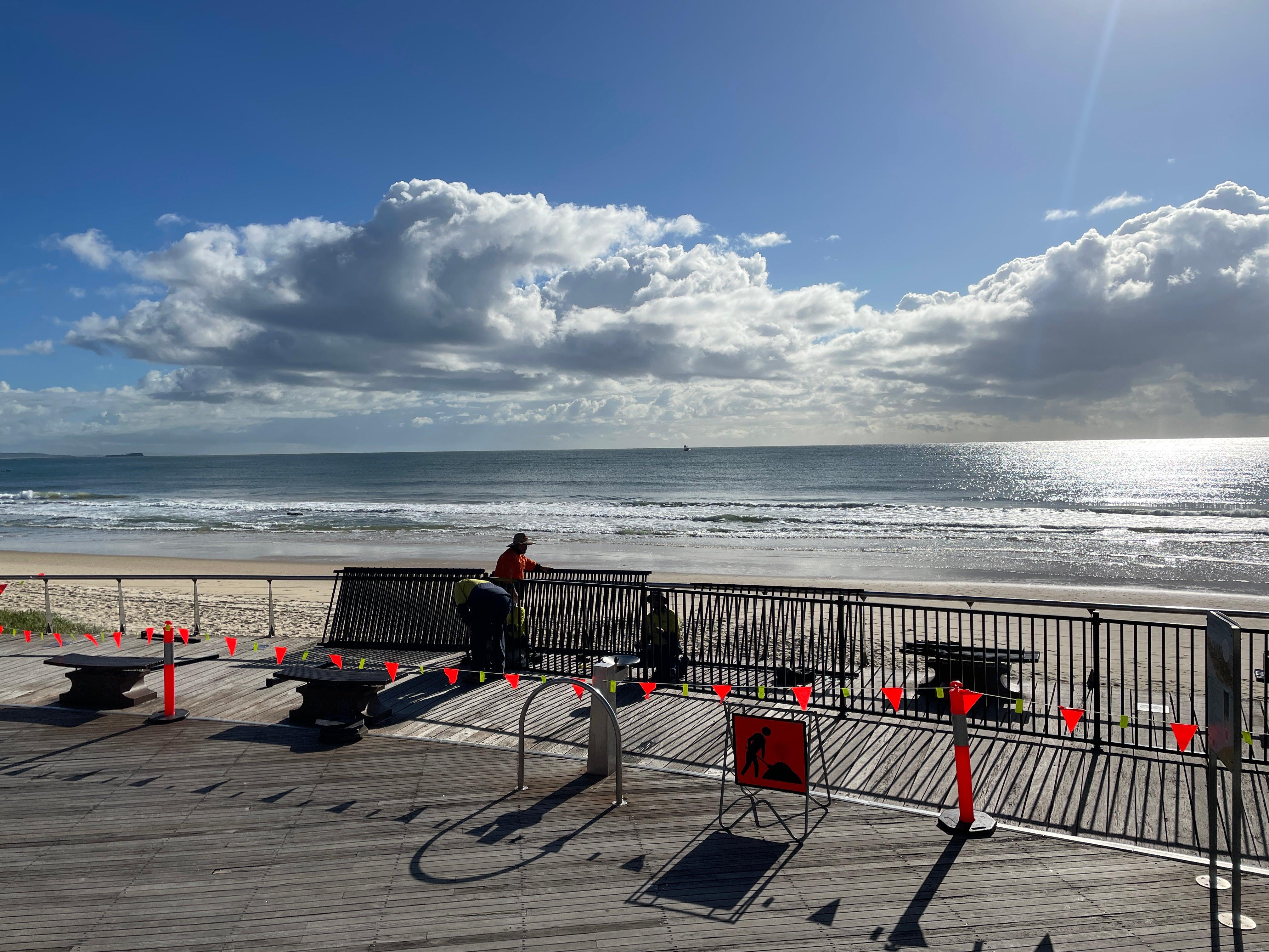 Construction of pedestrian barrier along cantilevered deck.