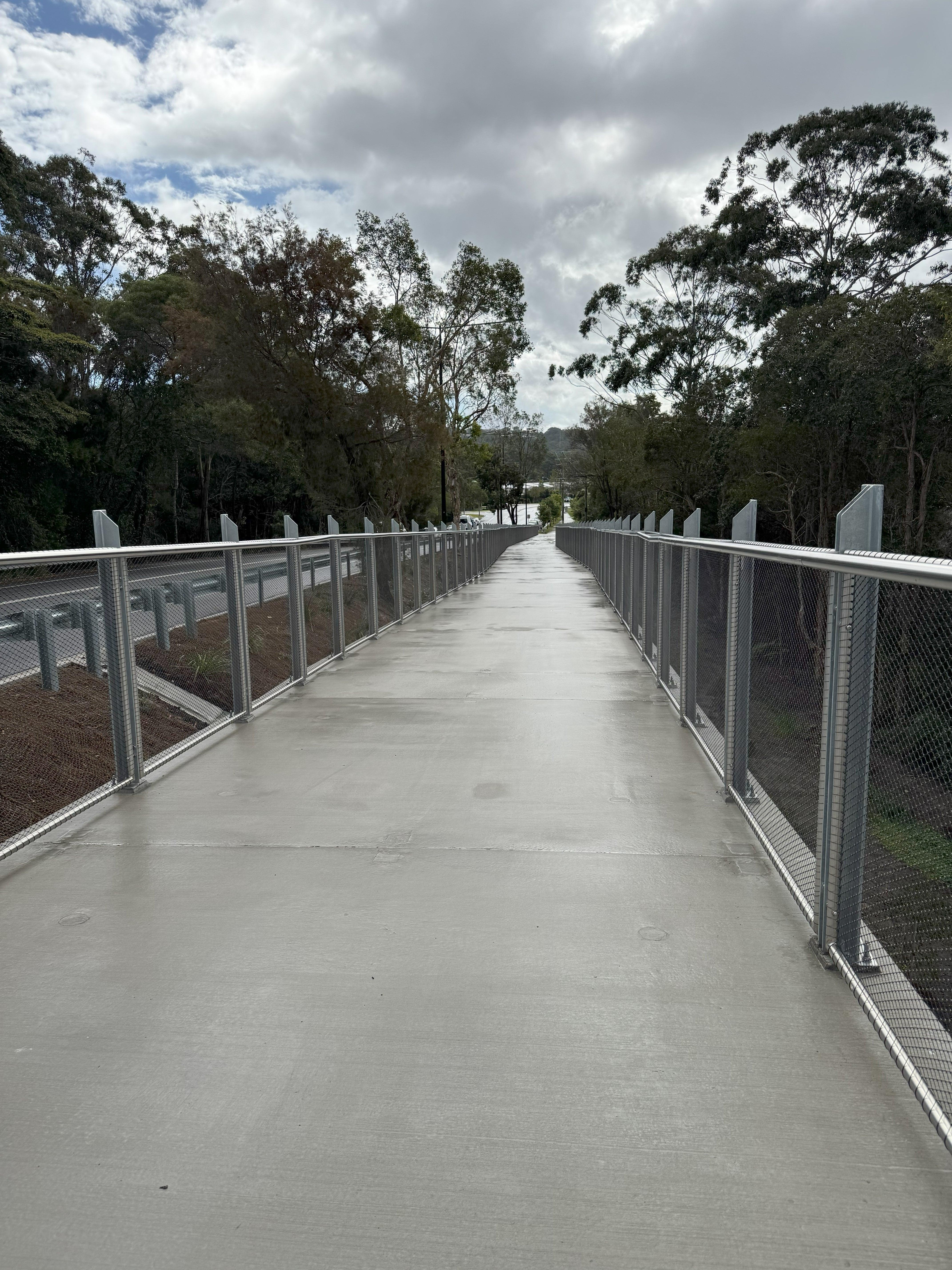 Wide concrete pathway along Stringybark Road, Sippy Downs.
