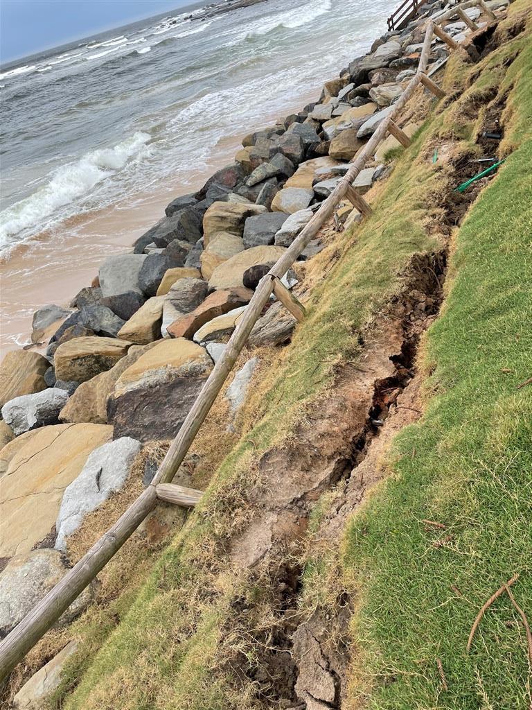 Cracks in the ground indicate damage to the Moffat Beach Seawall - March 2022.